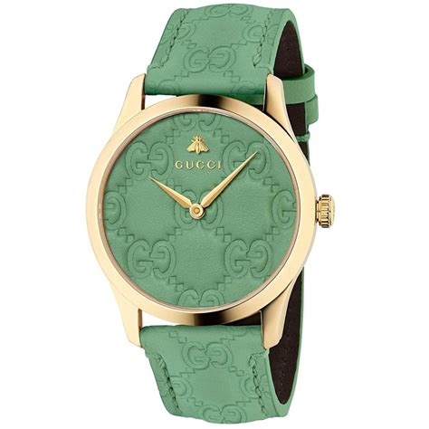 gucci watch green face.